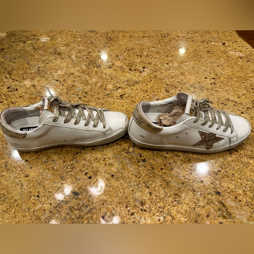 Side view of golden goose sneakers